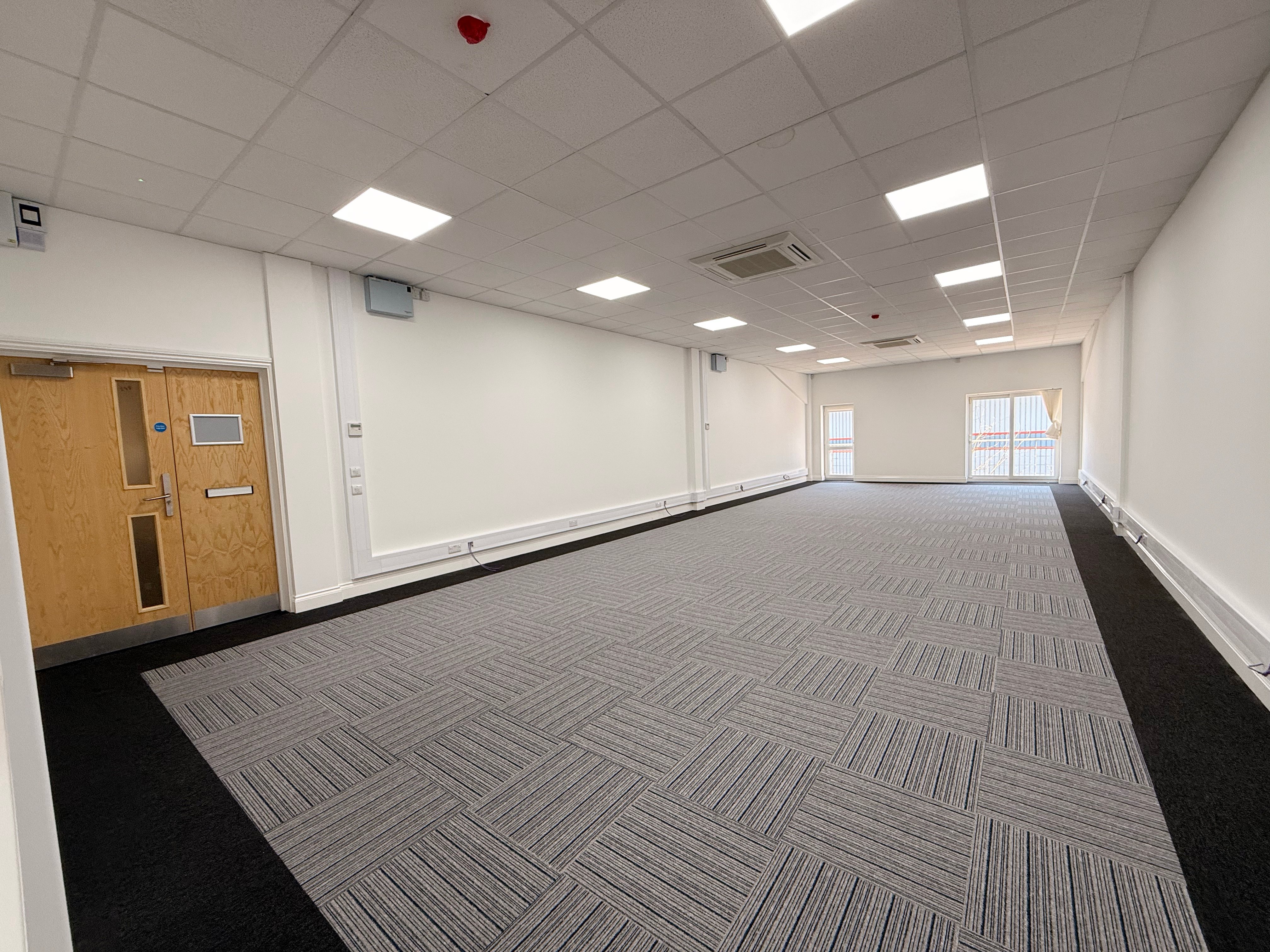 Large office with window and sub room